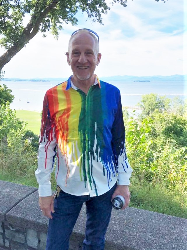 Mack* Roark wearing rainbow paint shirt by Lake Champlain