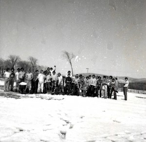 The 1975 lacrosse team shovels snow off the field. The team went on to become Middlebury's first ECAC Lacrosse Champions