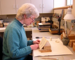 Ginny Faust in the Conservation Workroom.