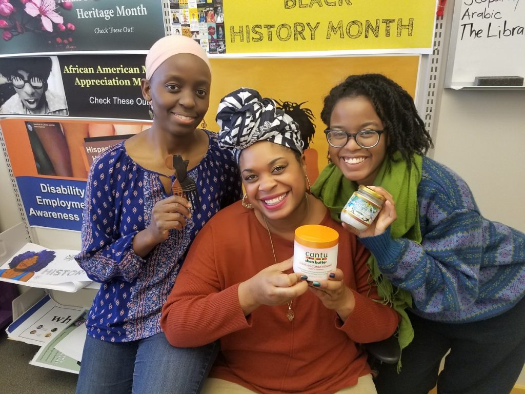 three women holding products