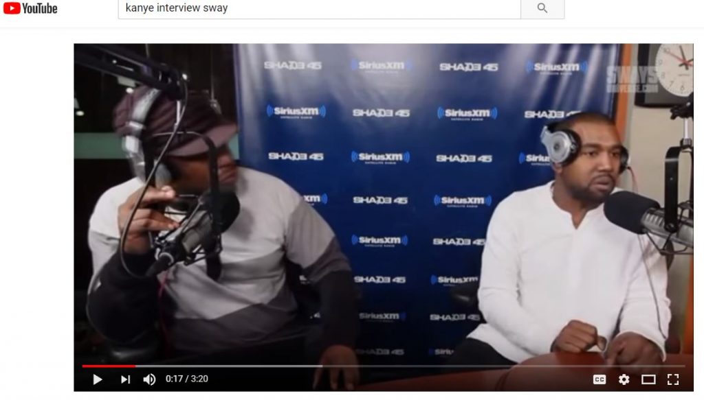 a screenshot of two men at a radio station