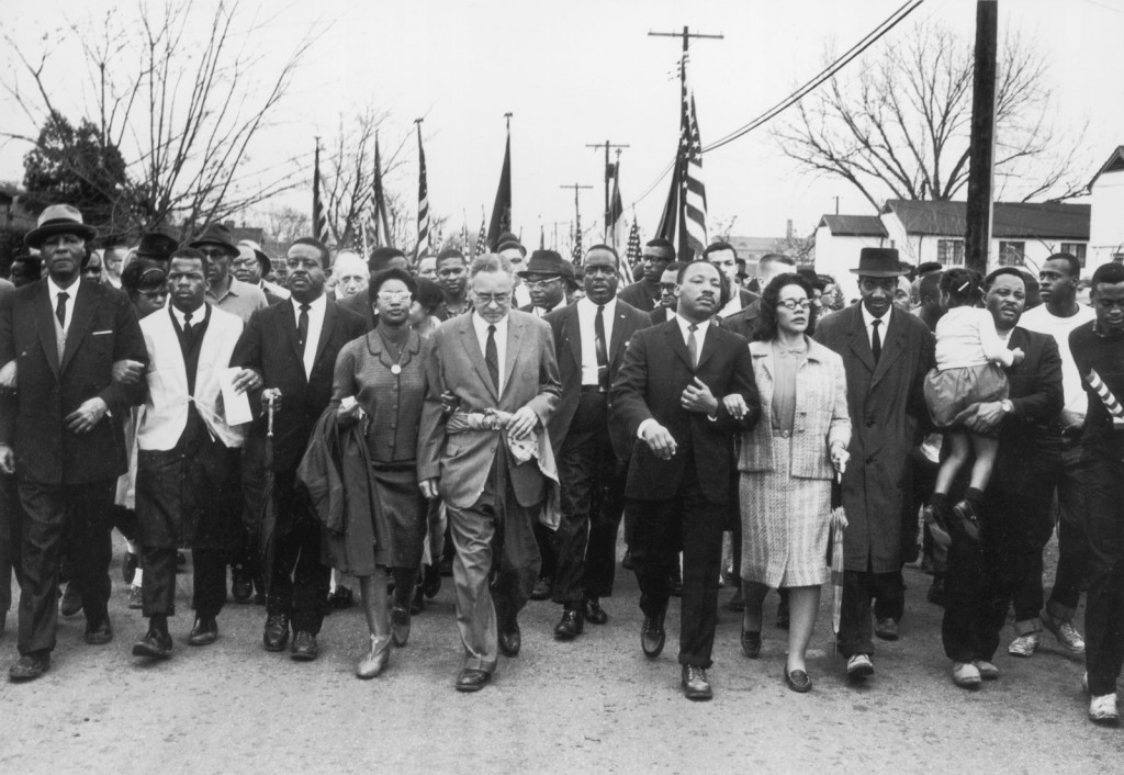 Arm in arm, Martin Luther King, Jr., and his wife, Coretta Scott King (in light-coloured suit), leading the voting rights march from Selma to Montgomery, Alabama, March 1965.