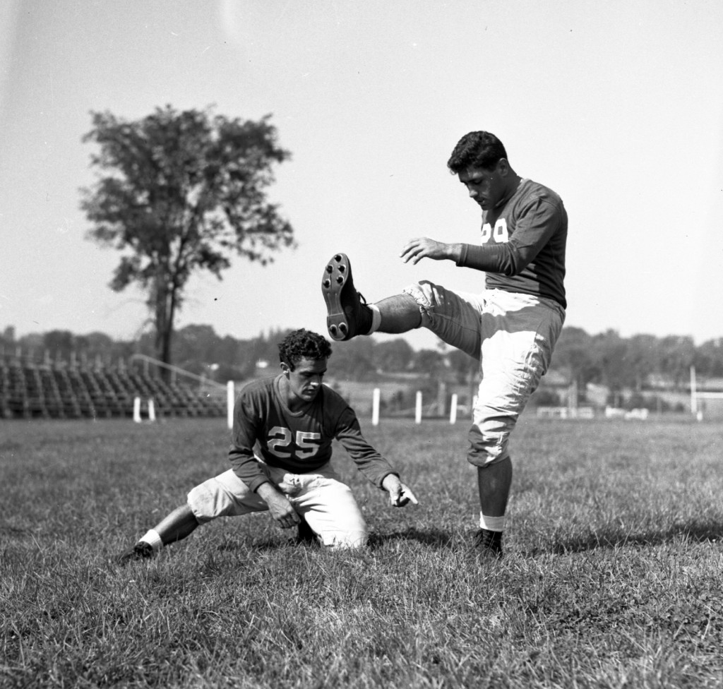 Two players from the 1947 lineup practice the skills that won them the state championship.