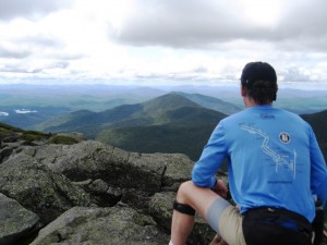 A trailrunner enjoys the summit views