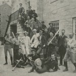 Photograph of male students wielding baseball bats and tennis rackets and striking athletic poses from the 1880s.