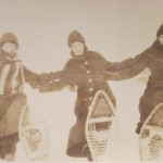 Photograph of three women snow-shoeing on campus circa 1916.