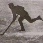 Photograph of hockey player on outdoor rink, circa 1923.